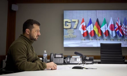 Ukrainian President Volodymyr Zelenskiy joins a video conference with leaders of the Group of Seven as part crisis talks, on 11 October 2022.