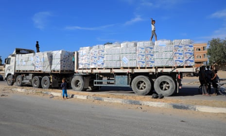 A truck carrying humanitarian aid arrives at a UN agency warehouse in Khan Younis, southern Gaza, on Friday