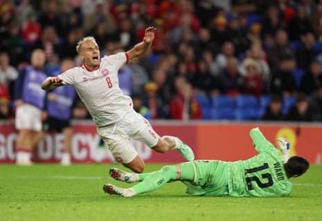 Wales' Danny Ward concedes a penalty against Denmark's Gustav Isakse.