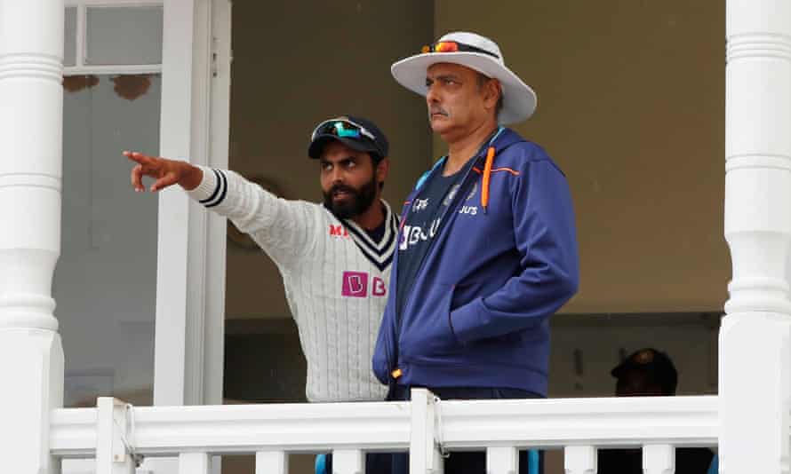 Ravindra Jadeja and the India head coach, Ravi Shastri, survey Trent Bridge as rain delays play during the first Test against England.