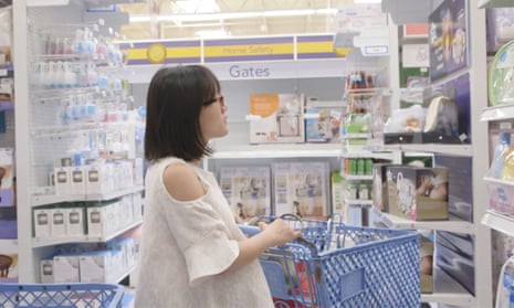 woman in a pharmacy looking at baby products