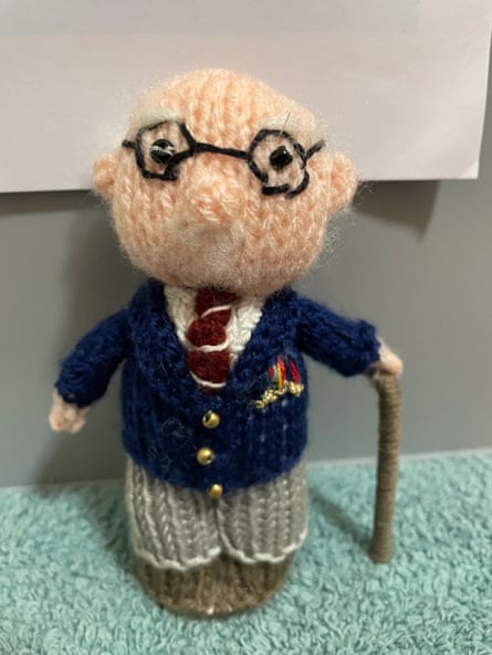 A knitted Capt Tom doll.