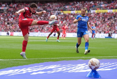 Jamie Jellis (left) and Wimbledon’s Joe Lewis