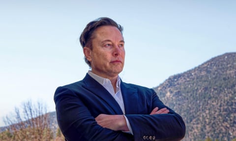 Elon Musk stands with his arms folded outside in Colorado Springs, Colorado, in 2022