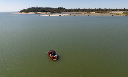 A boat floats in the Granite Bay area of Folsom Lake.