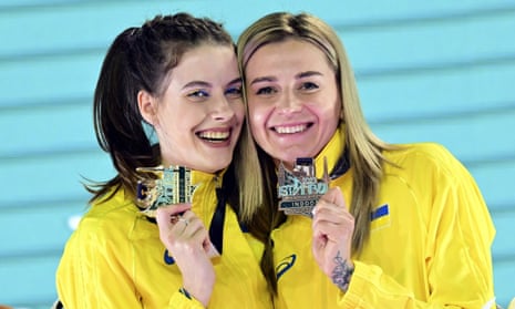 Gold medalist Yaroslava Mahuchikh (left) and bronze medalist Kateryna Tabashnyk (right), both of Ukraine, pose after competing in the women’s high jump during European Athletics Indoor Championships.