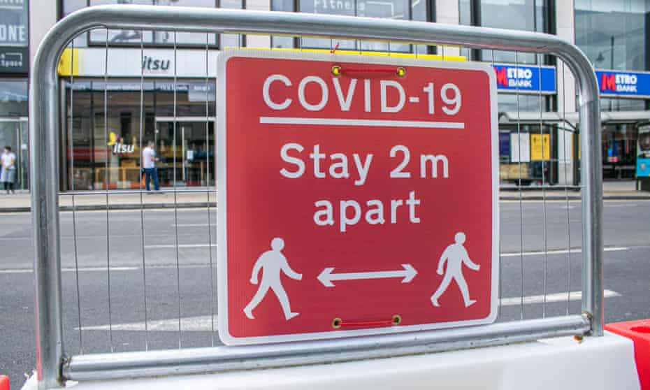 A ‘Covid-19 stay 2 metres apart’ sign is seen in Wimbledon town centre