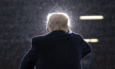 Donald Trump<br>President Donald Trump speaks in the rain during a campaign rally at Capital Region International Airport in Lansing Mich., on Oct. 27, 2020. (AP Photo/Evan Vucci)