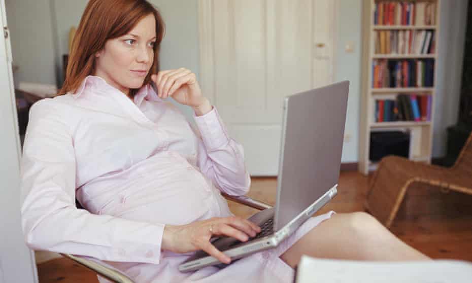 Pregnant woman using laptop computer