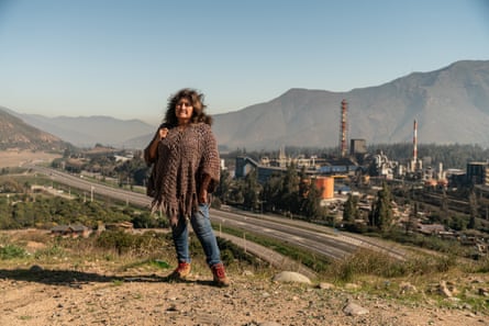 Rosa Neira in the foreground, with Anglo American Chagres foundry in the distance, backed by mountains.
