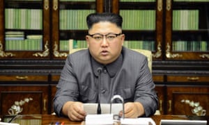 North Korea’s leader Kim Jong Un reads out his statement on state TV.