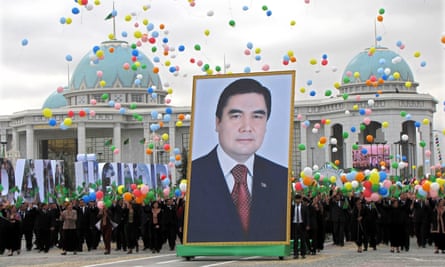 Citizens carry a picture of Turkmen president Gurbanguly Berdimuhamedov through Ashbagat, a city where political dissent is not allowed.