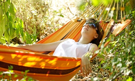 Woman sleeping in a hammock