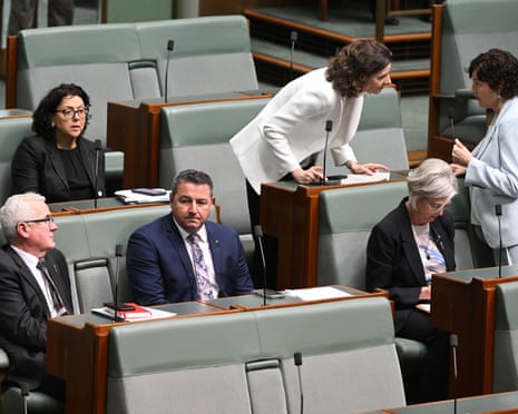 s member for Cowper Pat Conaghan crosses the floor during a division on the Gambling Reform Bill 2026, surrounded by independent MPs.