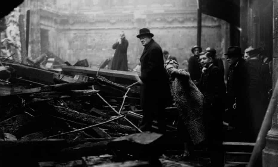 Winston Churchill inspecting bomb damage in the City of London during the blitz, December 1940