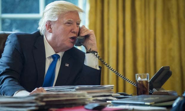 Donald Trump on the telephone to Vladimir Putin in the White House Oval Office
