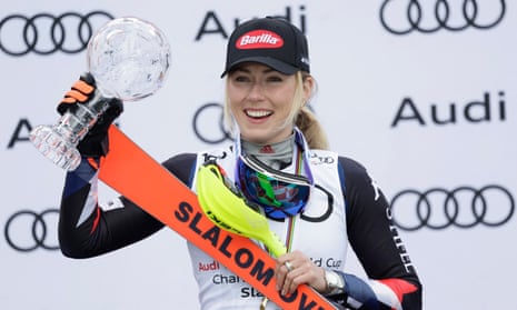 Mikaela Shiffrin celebrates on the podium after her record-extending 60th slalom win at the World Cup finals on Saturday.