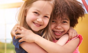 Two girls hugging