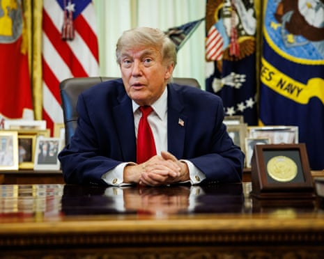 Donald Trump speaks from his desk in the Oval Office in the White House