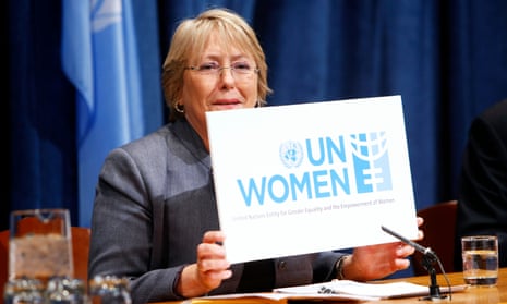 Michelle Bachelet, executive director of newly-created UN Women, holds up a sign for the organisation during a press conference on UN Women priorities for 2011.