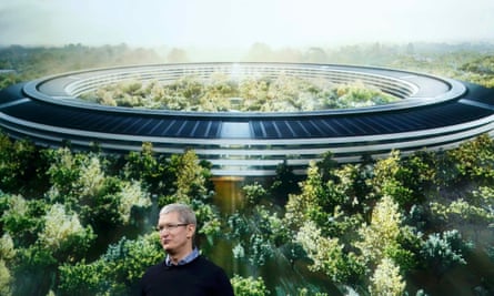 Tim Cook, Apple CEO, in front of a artist’s impression of its new Cupertino HQ.