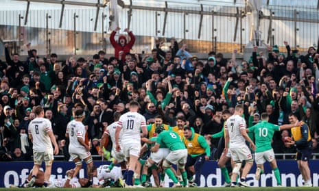 Ireland fans celebrate as Dan Sheehan scores their first try.