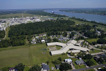 The Fifth Ward primary school and domestic communities sit near the Denka plant, back left, in Reserve, Louisiana.