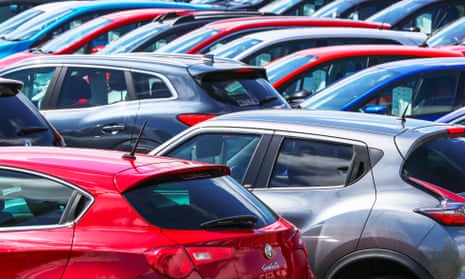 Various brands of secondhand cars for sale on a garage forecourt