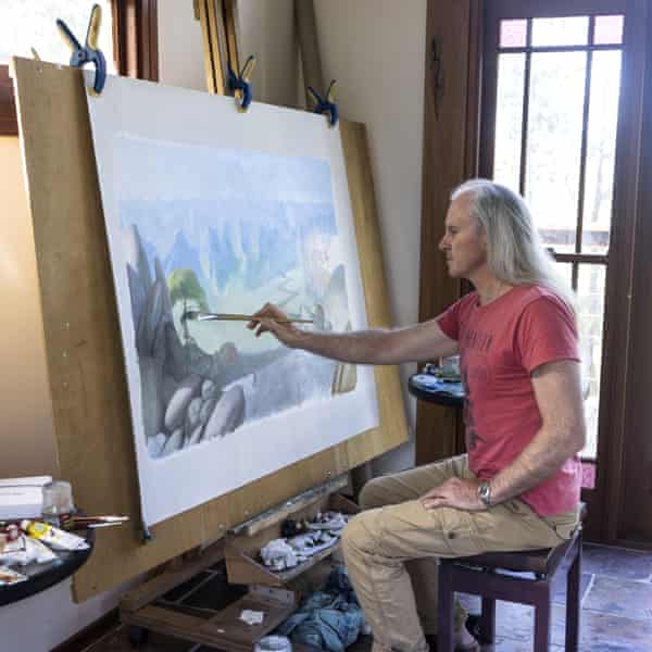 Matt Ottley painting in his studio in Uki, New South Wales