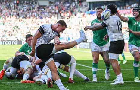 Gabriel Rupanu of Romania kicks a box-kick that hits teammate Fonovai Tangimana's head during the 2023 Rugby World Cup Pool B match between Ireland and Romania at Stade de Bordeaux.