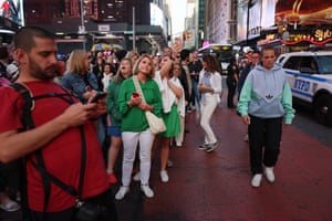 People wait on 42nd street to see the celestial show