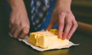 Butter with … chunky chips, iced buns or steamed pudding? Readers spill the beans on their tasty little secrets and techniques | For the love of butter 2 Hand hold the knife cutting the butter