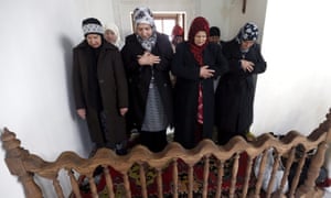 Bosnian Muslim women pray at the reconstructed mosque.
