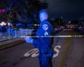 a police officer stands on a street