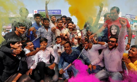 BJP supporters celebrate in Ahmedabad after Yogi Adityanath was sworn in as chief minister of Uttar Pradesh.