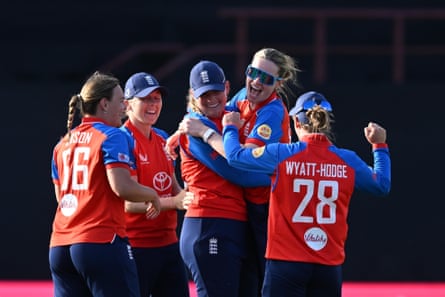 Sophie Ecclestone celebrates with her teammates