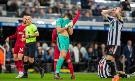 Nick Pope covers his face in disbelief after his red card for Newcastle