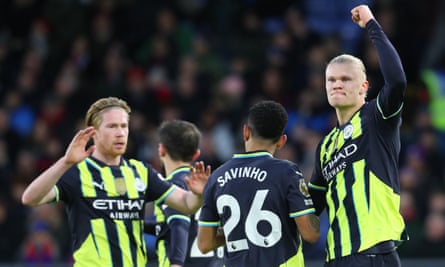 Erling Haaland (right) celebrates his equaliser against Crystal Palace, a goal that put him level with Mohamed Salah at the top of the Premier League scoring charts.