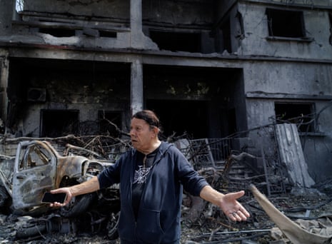 A man with his arms outstretched in protest.