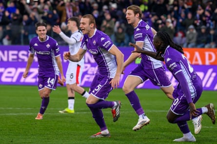 Pietro Comuzzo races off to the home support after opening the scoring for struggling Fiorentina against Milan