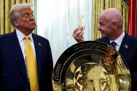 Fifa president Gianni Infantino hands Donald Trump a golden key in the Oval Office.