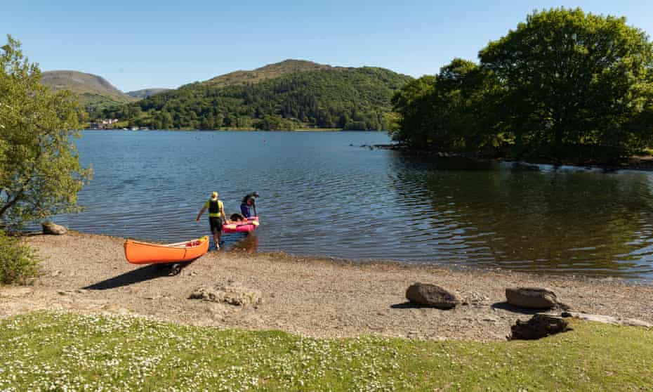 Two people Canoeing on Windermere from Low Wray Campsite.