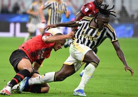 Malick Thiaw (left) fouls Mouse Kean (right) during the Serie A football match between Milan and Juventus in at the San Siro.