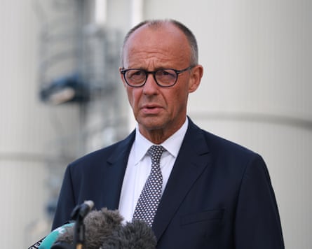 Man in glasses and a suit and tie.