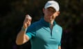 Rory McIlroy holds up his ball after making an eagle putt on the 13th hole during the final round of the 2022 Masters.