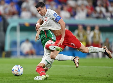 Mexico’s Héctor Moreno brings down Robert Lewandowski to concede a penalty