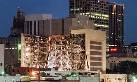 Floodlights illuminate the Albert P. Murrah Federal Building in Oklahoma City 20 April 1995 as rescuers continue searching for bodies in the aftermath of the 19 April explosion caused by a fuel-and fertilizer truck bomb that was detonated early 19 April in front of the building. The blast, the worst terror attack on US soil, killed 168 people and injured more than 500. Timothy McVeigh, convicted on first-degree murder charges for the 19 April bombing was sentenced to death in 1997. AFP PHOTO BOB DAEMMRICH (Photo credit should read BOB DAEMMRICH/AFP via Getty Images)