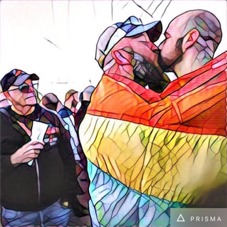 A couple shares a kiss in San Francisco at a gathering to remember the victims of the Orlando LGBT nightclub mass shooting.