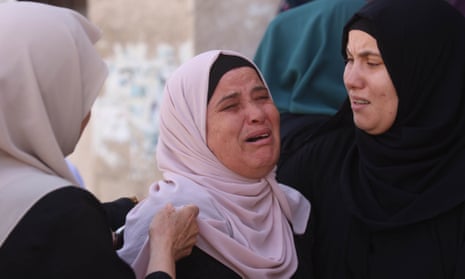 Relatives of Palestinians who lost their lives in an Israeli attack on Jenin refugee camp mourn during the funeral ceremony in Jenin, West Bank on Sunday.