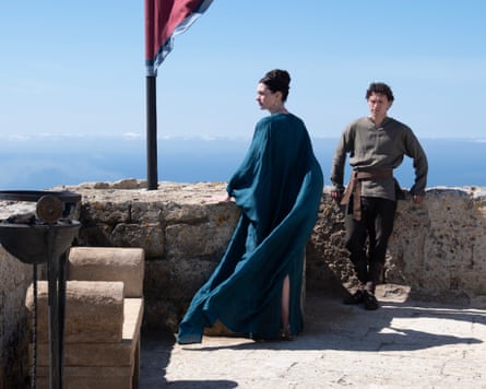 Man and woman standing on a roof
